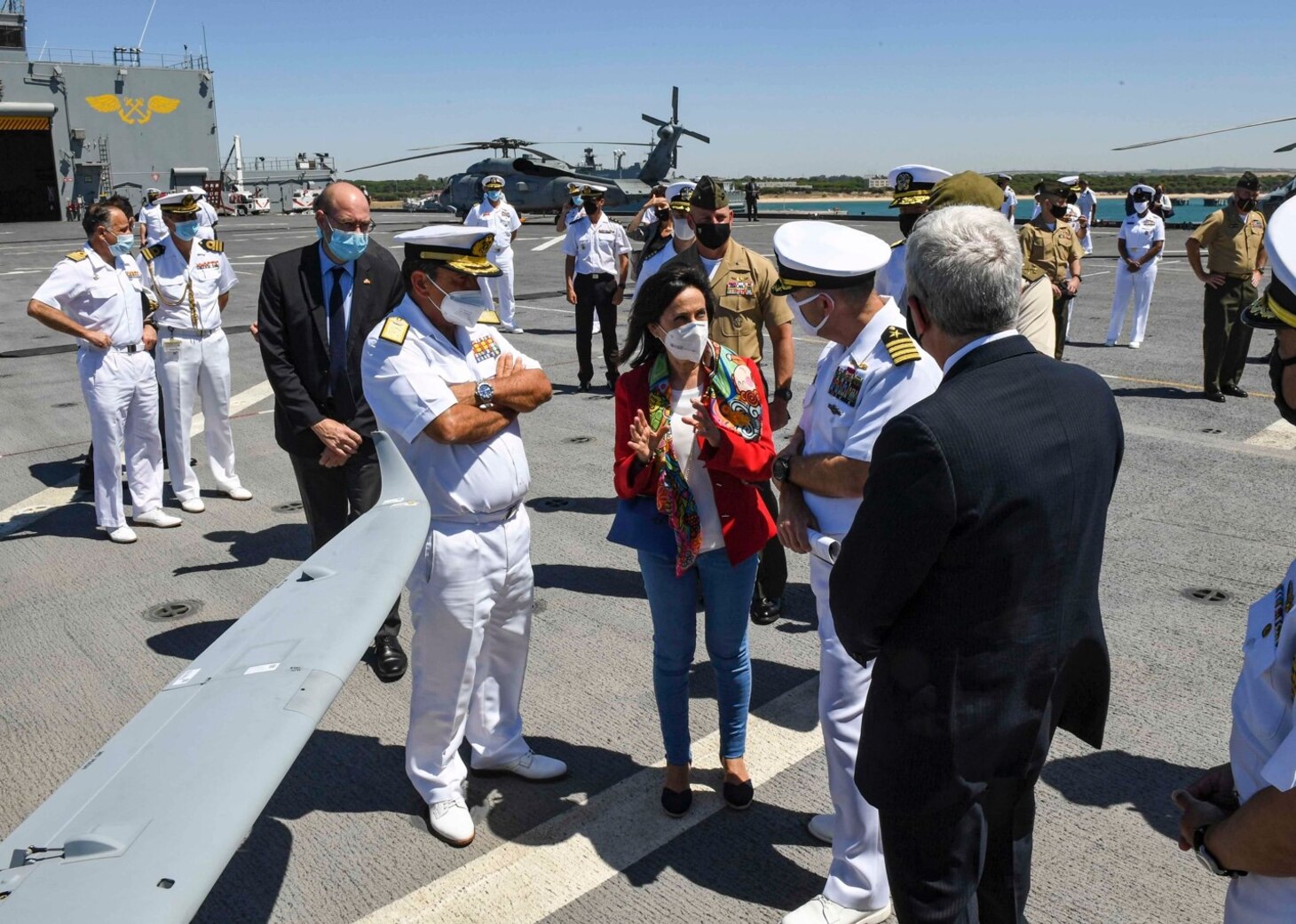 (July 8, 2021) Spanish Minister of Defense Margarita Robles, center, speaks with Capt. Michael Concannon, commanding officer, right, about the ship’s flight deck capabilities during a tour aboard the Expeditionary Sea Base USS Hershel “Woody” Williams (ESB 4) in the Atlantic Ocean, July 8, 2021. Hershel “Woody” Williams is on a scheduled deployment in the U.S. Sixth Fleet area of operations in support of U.S. national interests and security in Europe and Africa.