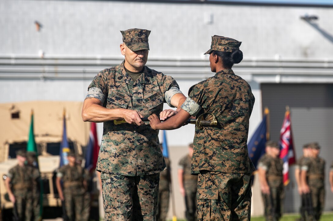 U.S. Marine Corps Sgt. Maj. Joseph Sorgie, sergeant major, 2nd Maintenance Battalion, takes his post during a relief and appointment ceremony at Camp Lejeune, North Carolina, July 9, 2021. During the ceremony, Sgt. Maj. Joe N. Wilborn Jr., was retired and Sgt. Maj. Joseph Sorgie was appointed as the sergeant major of 2nd Maintenance Battalion. The ceremony symbolizes the passing of trust and confidence from the outgoing sergeant major to the incoming sergeant major. (U.S. Marine Corps photo by Lance Cpl. Zachary Zephir)