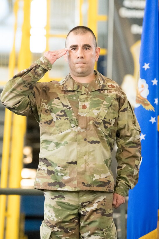 Maj. Shawn Cox, 736th Aircraft Maintenance Squadron commander, accepts his first salute  during a change of command ceremony at Dover Air Force Base, Delaware, July 9, 2021. The ceremony saw Lt. Col. Kevin Scholz, relinquish command to Cox. The squadron is responsible for the inspection, repair, launch and recovery of eight C-17 Globemaster III aircraft. (U.S. Air Force photo by Mauricio Campino)