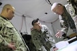 412th TEC Soldiers plan out scenarios during annual summer exercise at Schofield Barracks on 21 June.