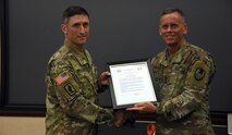 Col. David J. Mulack receive his charter as the incoming Army Capability Manager for Space and High Altitude from Lt. Gen. Daniel L. Karbler, commanding general, U.S. Army Space and Missile Defense Command, during a Change of Charter ceremony at the command’s Redstone Arsenal, Alabama, headquarters, July 9. The ACM SHA, part of SMDC’s Space and Missile Defense Center of Excellence, serves as the Army’s centralized fielded force integrator for space and high altitude operations. Mulack takes over the position from Col. Timothy G. Dalton, who is leaving the command for a new assignment. (U.S. Army photo by Carrie David Campbell)