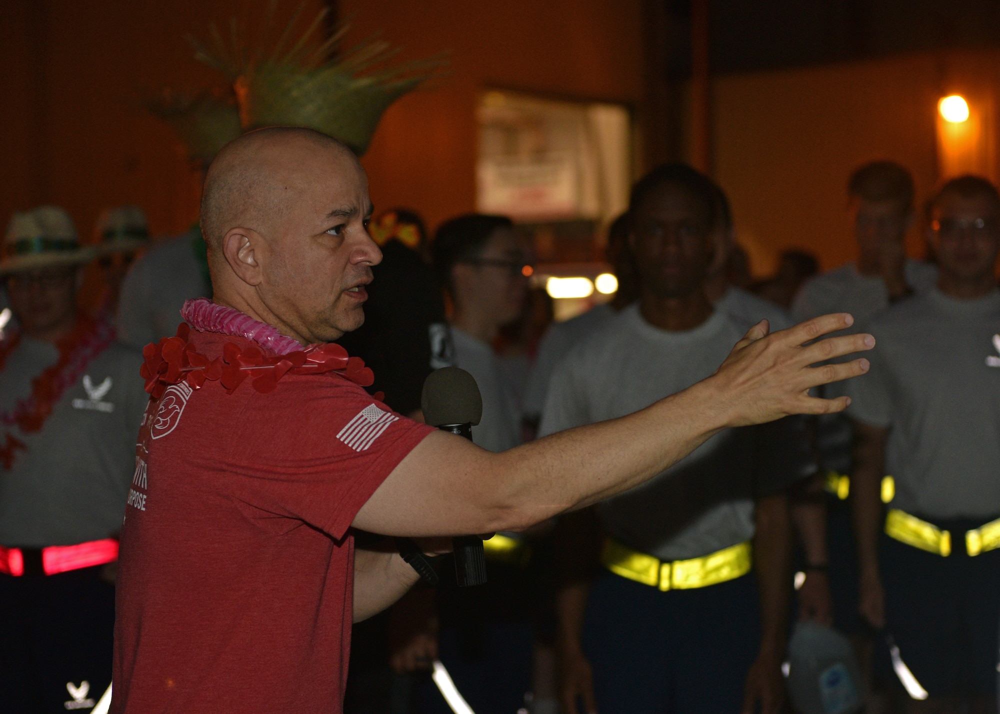 U.S. Air Force Col. Andres Nazario, 17th Training Wing commander, addresses the crowd at the NAZA-PA-LUAU Wing Fun Run on Goodfellow Air Force Base, July 9, 2021. The 17th TRW participated in the Fun Run to bid Nazario farewell before his change of command on July 13. (U.S. Air Force photo by Senior Airman Ashley Thrash)