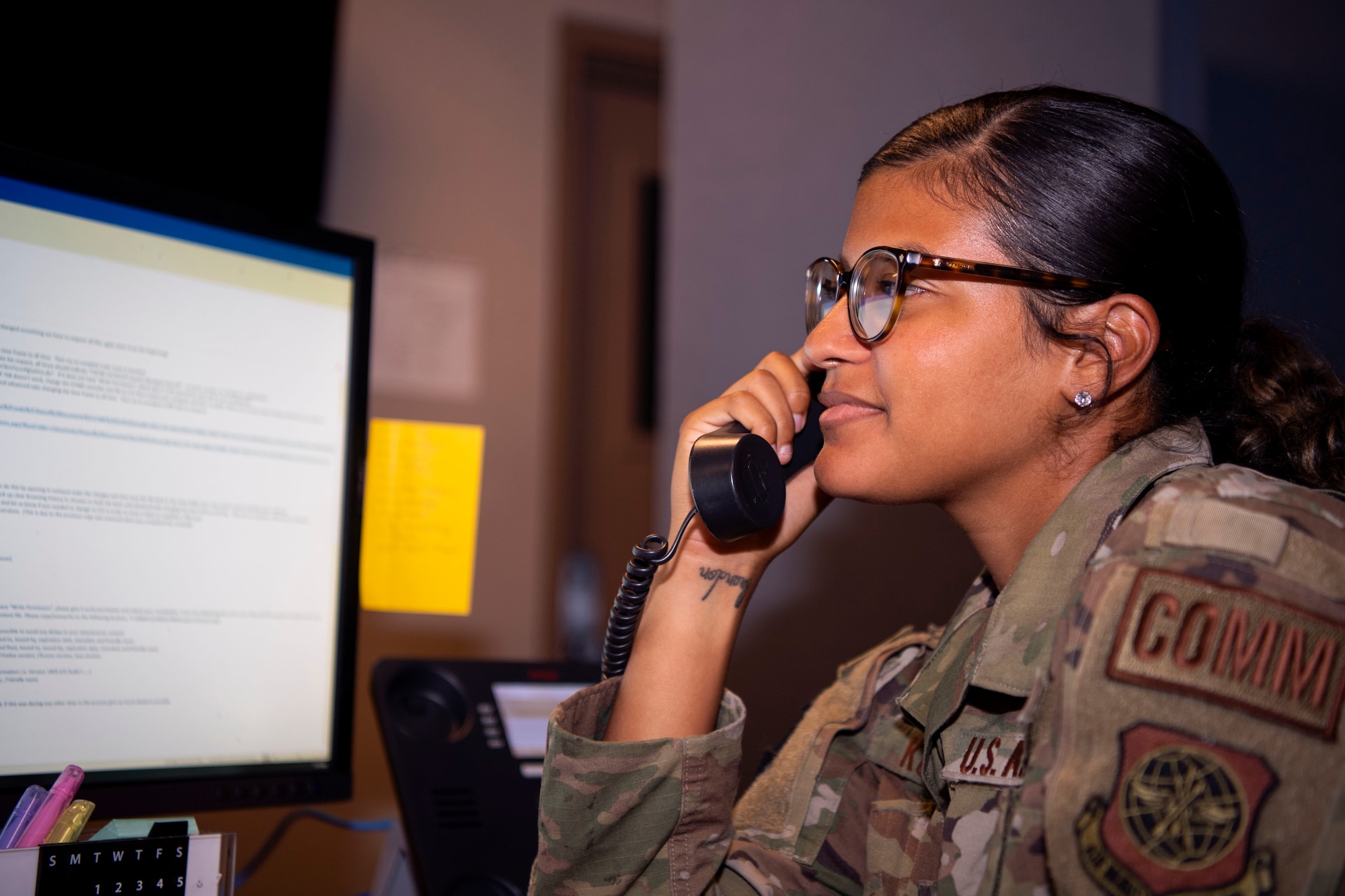 Senior Airman Vanessa Kozicki, a 6th Communications Squadron (CS) communications specialist, answers a phone call at MacDill Air Force Base, Florida, July 8, 2021.