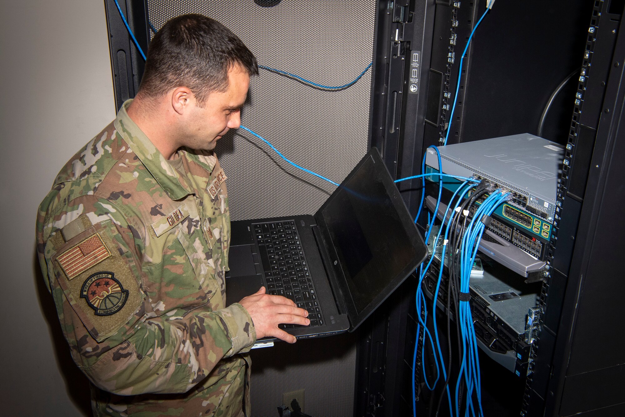 Tech. Sgt. Patrick Gildea, a 6th Communications Squadron (CS) Mission Defense Team supervisor, runs a diagnostic test on a computer server at MacDill Air Force Base, Florida, July 8, 2021.