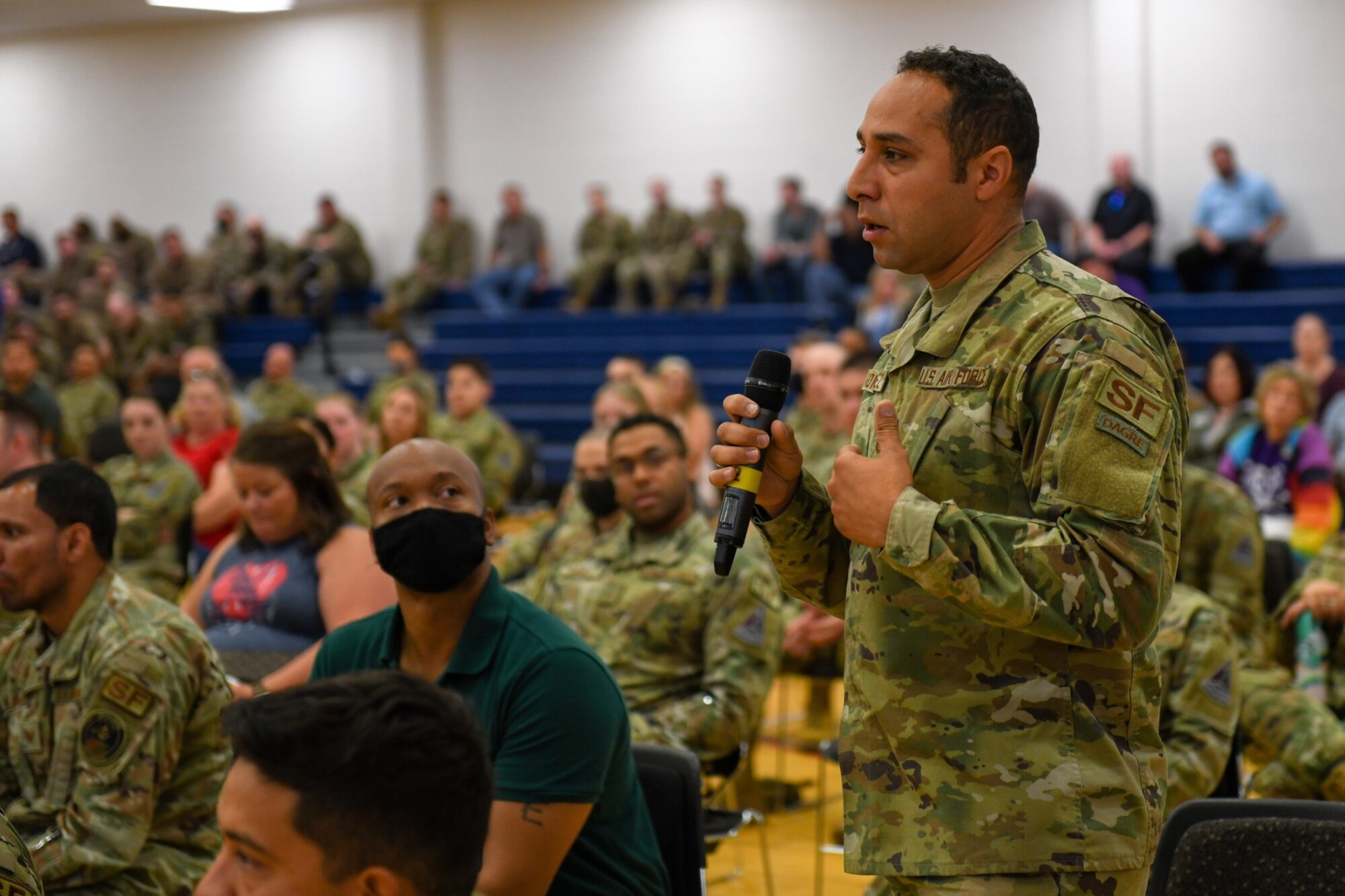 An Airman from the 460th Security Forces Squadron asks for clarification regarding which major command he falls under during the first commander's call for Col. Marcus Jackson, Buckley Garrison commander, at Buckley Space Force Base, Colo., July 9, 2021.
