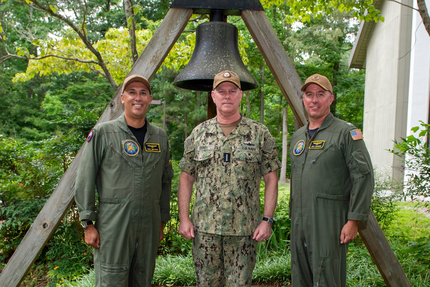 Adm. Christopher W. Grady, commander, U.S. Fleet Forces Command, poses with Capt. Thomas A. Esparza, left, and Capt. Jeffery D. Sowers after their change of command at Naval Weapons Station Yorktown, July 8, 2021.