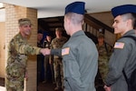 Maj. Gen. Jeffrey T. Pennington, 4th Air Force commander, fist bumps Airman 1st Class John Scheurer, a C-5M Super Galaxy Formal Training Unit student, at Joint Base San Antonio-Lackland, Texas, July 7, 2021. Pennington toured the 733rd Training Squadron dorms for aircrew (pilot, loadmaster and flight engineer) students. (U.S. Air Force photo by Senior Airman Brittany Wich)