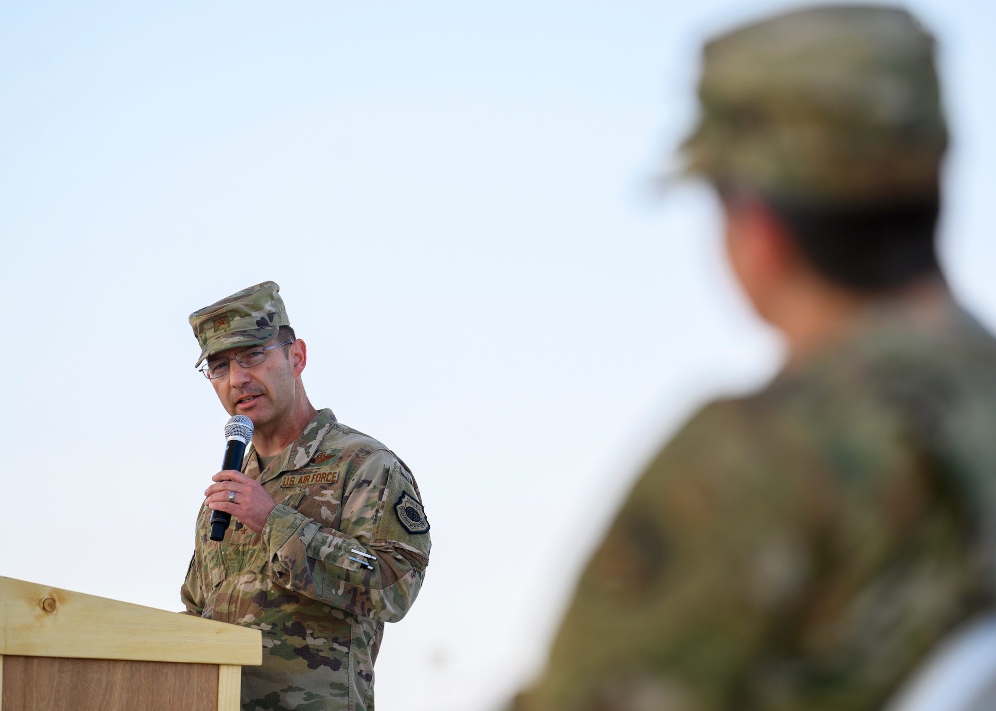 U.S. Air Force Brig. Gen. Robert Davis, 378th Air Expeditionary Wing commander, delivers his speech during the 378th Expeditionary Mission Support Group change of command ceremony, Prince Sultan Air Base, July 5, 2021. The 378th EMSG provides full spectrum support to the 378th AEW and joint partners, sustaining and defending forces to enable combat power projection in the region. (U.S. Air Force photo by Senior Airman Samuel Earick)