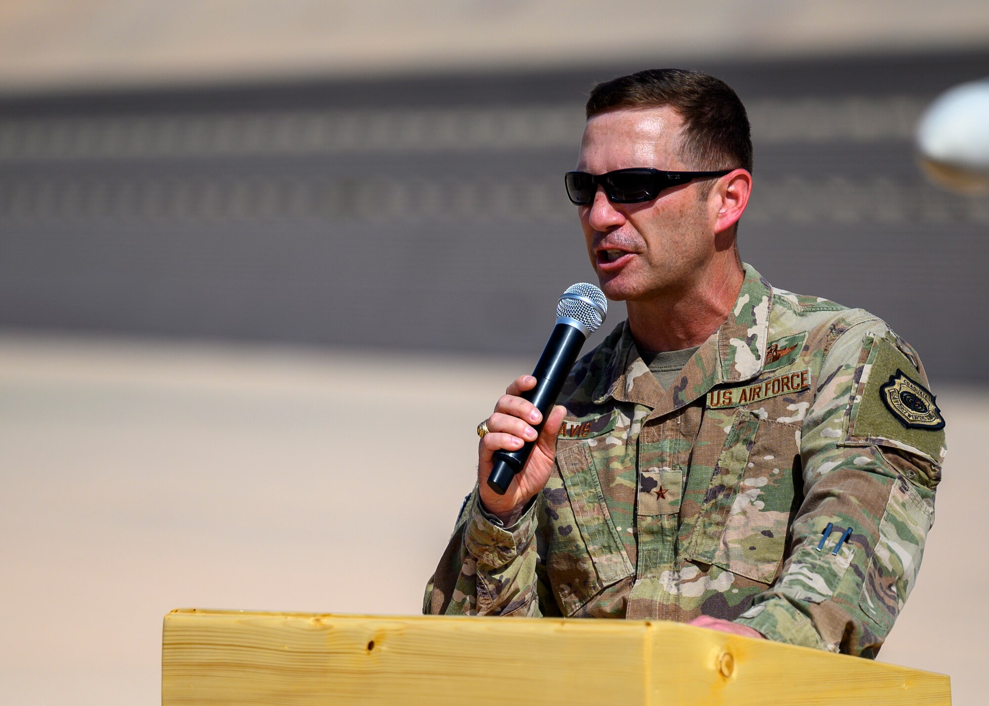 U.S. Air Force Brig. Gen. Robert Davis, 378th Air Expeditionary Wing commander, addresses the audience during the 378th Expeditionary Operations Group change of command ceremony, Prince Sultan Air Base July 5, 2021. The 378th EOG provides combat power projection in support of U.S. Central Command plans and operations. (U.S. Air Force photo by Senior Airman Samuel Earick)