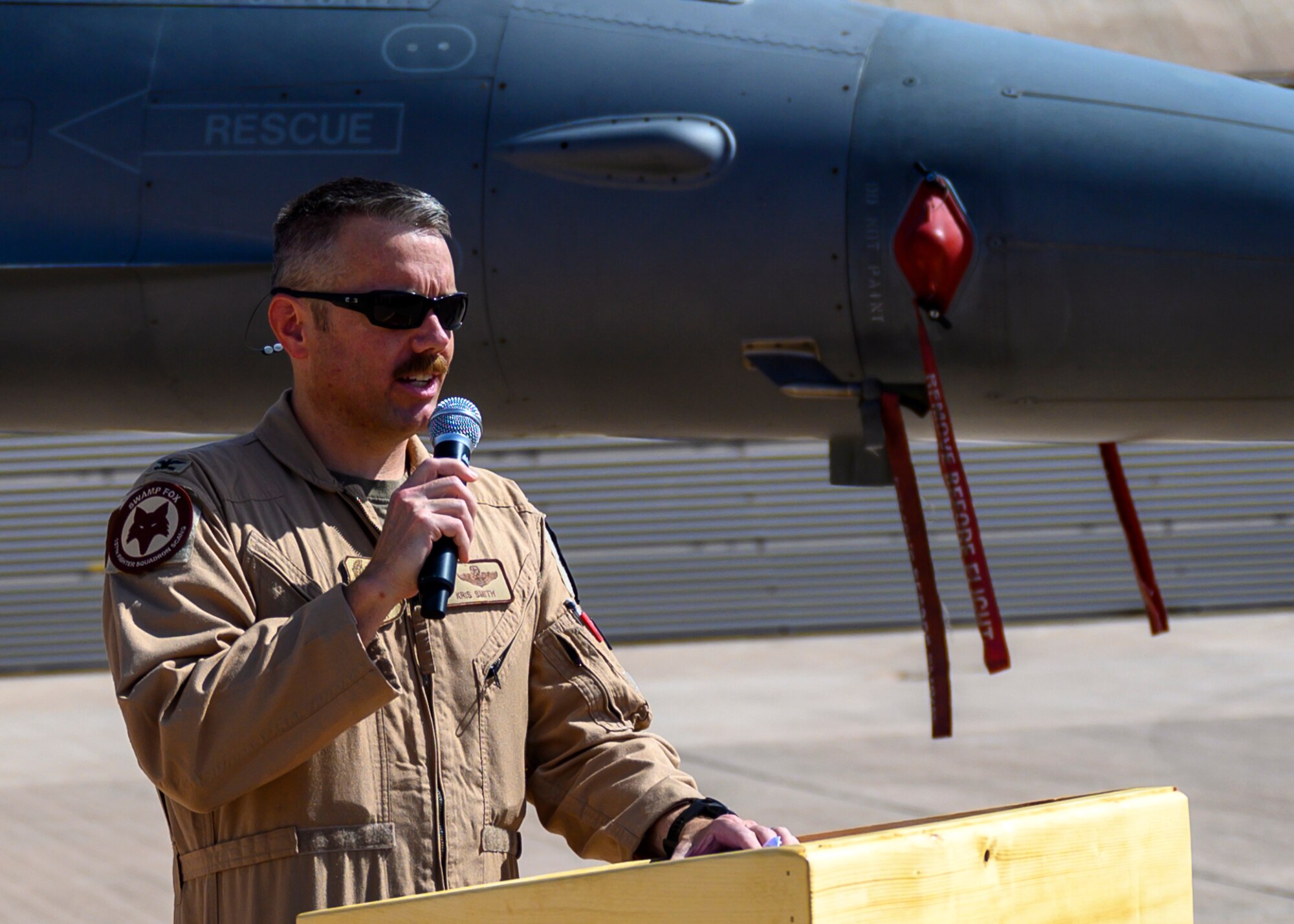 U.S. Air Force Col. Kristoffer “Smirk” Smith, outgoing 378th Expeditionary Operations Group commander, addresses the audience during the group change of command, Prince Sultan Air Base, July 5, 2021. The 378th EOG provides combat power projection in support of U.S. Central Command plans and operations. (U.S. Air Force photo by Senior Airman Samuel Earick)