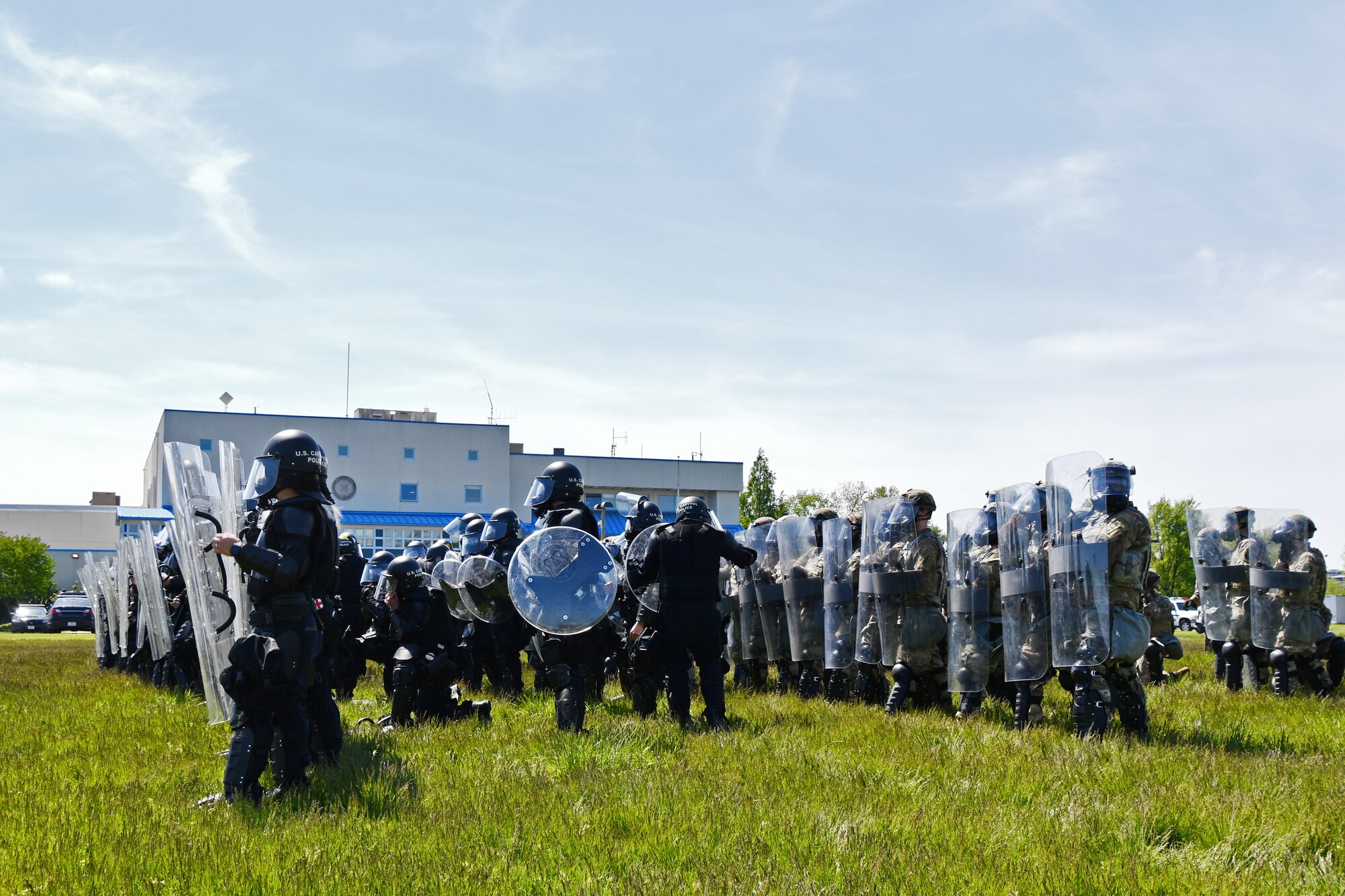 U.S. Army and Air National Guardsmen participate in a Civil Disturbance Unit training event with Capitol Police at the Park Police training grounds in Washington, D.C., April 27, 2021. Since January, Army and Air National Guard units from around the country have provided ongoing security, communication, medical, evacuation, logistical and safety support to capital civil authorities. (U.S. Air National Guard photo by Staff Sgt. Hanna Smith)