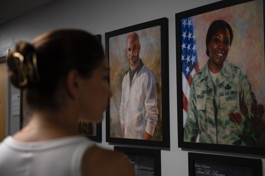 Jamie Gray Hyder, one of the stars of the television drama series Law & Order: Special Victims Unit, tours a Hall of Heroes, during an Office of Special Investigations mission immersion orientation July 1, 2021. (U.S. Air Force photo by SrA Amir Young, 316 WG/PA)
