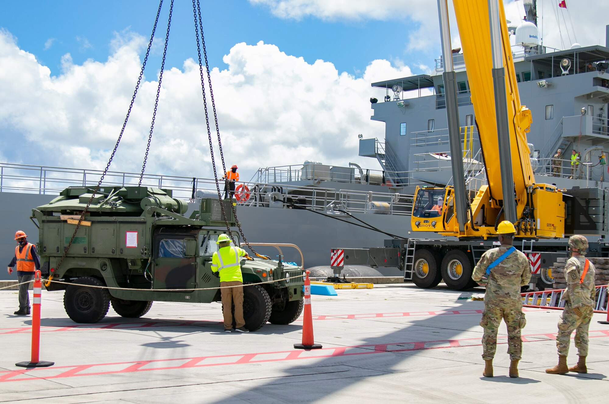 America’s First Corps Soldiers and civilian contractors unload military vehicles from the United States Army Vessel Lt. Gen. William B. Bunker, 8th Theater Sustainment Command, in support of Forager 21, at Naval Base Guam, July 10, 2021. Army Watercraft Systems provide strategic movement support to the Joint Force and are integrated with the Pacific Fleet’s maritime operation center. (U.S. Army photo by Spc. Richard Carlisi, I Corps Public Affairs)