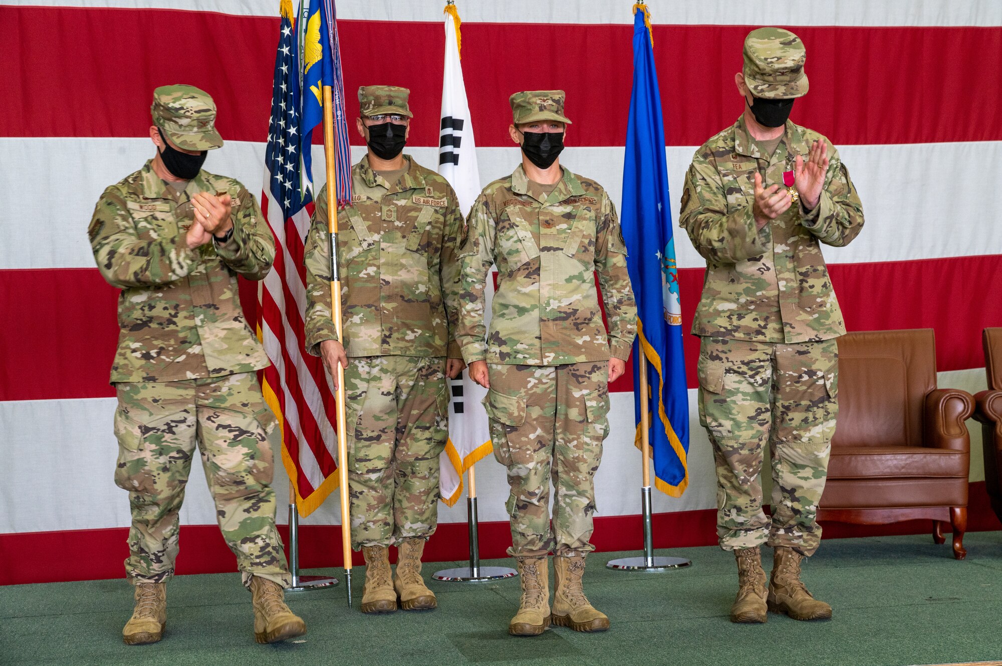 Col. Jennifer Vecchione, 51st Medical Group commander, center right, receives applause during the 51st Medical Group change of command at Osan Air Base, Republic of Korea, July 12, 2021. The change of command ceremony is deeply rooted in military tradition that dates back to the reign of King Frederick of Prussia and has persisted into modern day. (U.S. Air Force photo by Tech. Sgt. Nicholas Alder)