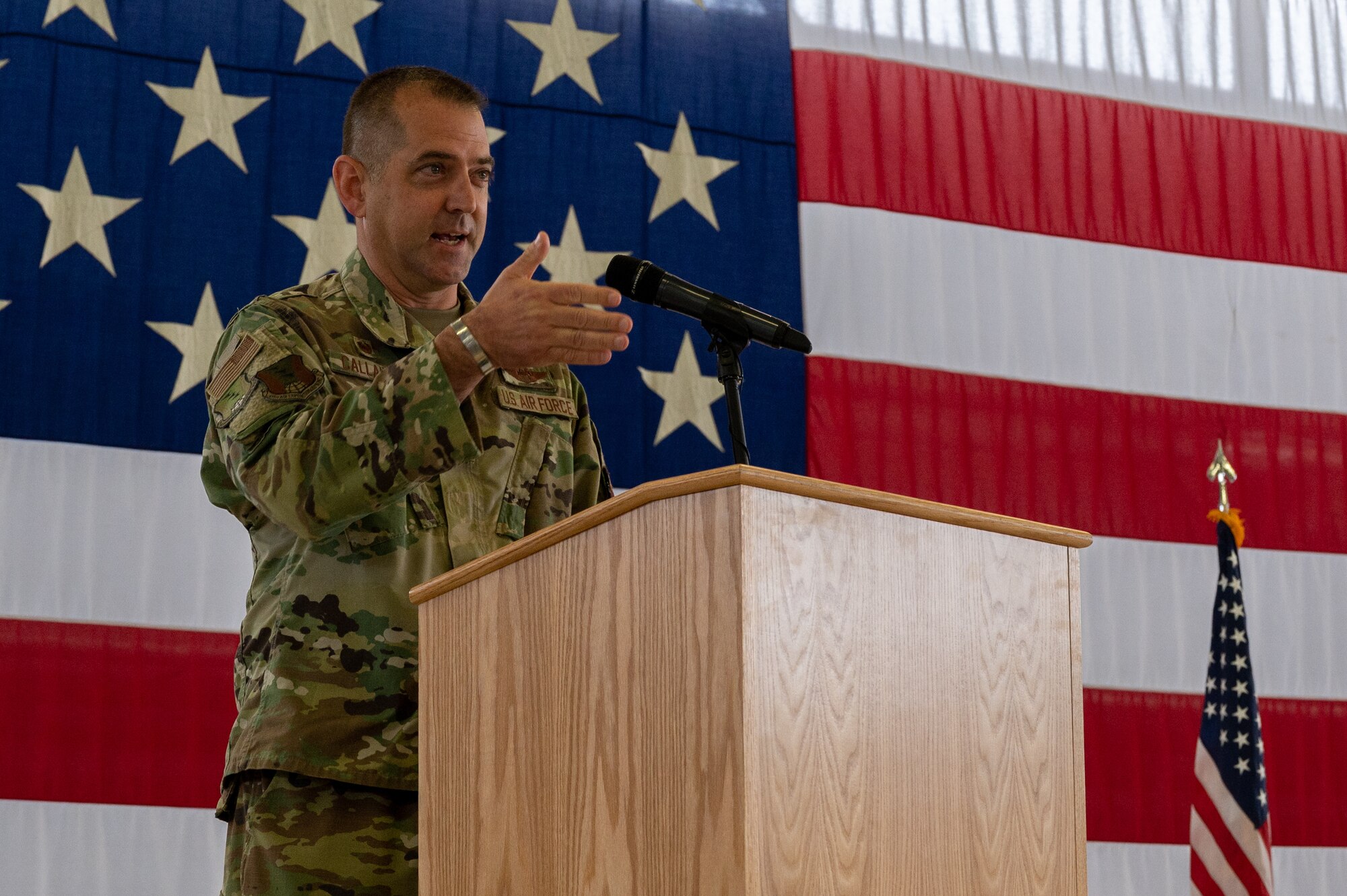 A commander standing behind a podium.