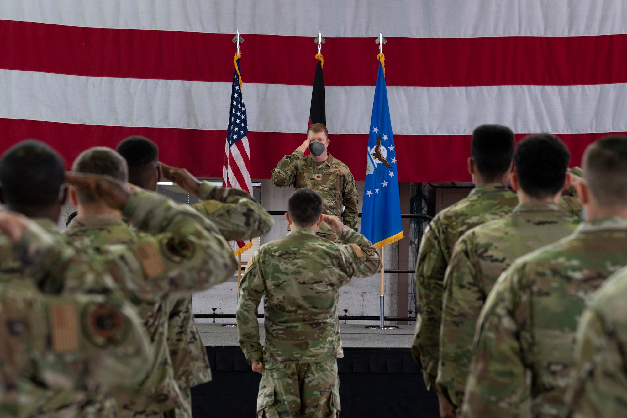 U.S. Air Force Maj. Kevin Walton, 52nd Maintenance Squadron commander, returns his first salute to U.S. Air Force Airmen from the 52nd MXS after assuming command of the squadron during a ceremony July 9, 2021, on Spangdahlem Air Base, Germany.