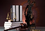 Judges wooden gavel and law books