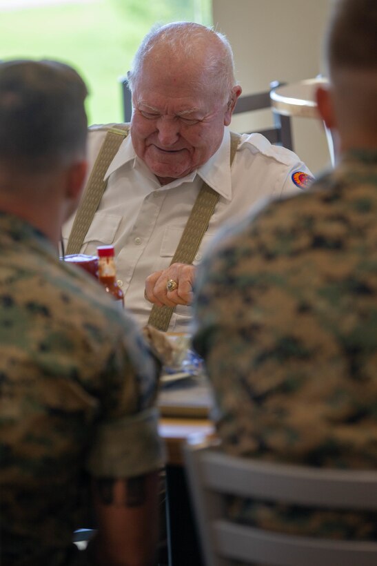 Retired U.S. Marine Corps Sgt. Lee Reed speaks with Marines from 3rd Battalion, 2d Marine Regiment (3/2), 2d Marine Division, about his experiences during World War II during a Warrior’s Breakfast at Camp Lejeune, N.C., July 9, 2021. Reed, who served in World War II while assigned to 3/2, visited the Marines to see how weapons and equipment have evolved, as well as to pass off wisdom and share his experiences. (U.S. Marine Corps photo by Lance Cpl. Reine Whitaker)