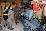 Master Sgt. Sean Preston, 433rd Maintenance Squadron aerospace propulsion specialist, explains the C-5M Super Galaxy engine mechanics to Texas Wing Civil Air Patrol cadets at Joint Base San Antonio-Lackland, Texas, July 8, 2021. The Cadets were able to ask in-depth questions to further their understanding. (U.S. Air Force photo by Senior Airman Brittany Wich)