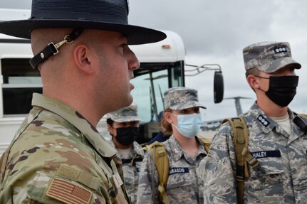 Tech Sgt. Nicholas Walker, 433rd Training Squadron military training instructor, directs Texas Wing Civil Air Patrol cadets to fall into formation at Joint Base San Antonio-Lackland, Texas, July 8, 2021. CAP was formed in 1941 and provides civilian aviation resources for emergency response, community services and youth development. (U.S. Air Force photo by Senior Airman Brittany Wich)