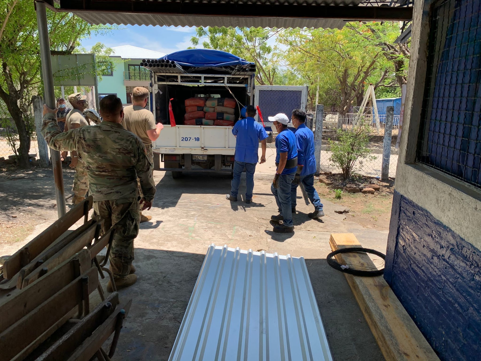 U.S. Army Soldiers with Joint Task Force-Bravo, Soto Cano Air Base, Honduras, donate construction materials to a school in Mogotillo, El Salvador.
