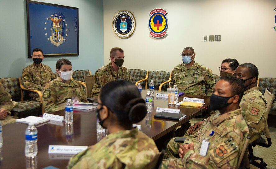 Command Sgt. Maj. Michael Gragg, Defense Health Agency senior enlisted leader, and 49th Medical Group leadership sit through a leadership in-brief, June 30, 2021, on Holloman Air Force Base, New Mexico. Gragg visited the 49th MDG to discuss the current state of the DHA and to address any areas of concern. (U.S. Air Force photo by Airman 1st Class Jessica Sanchez)