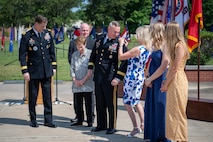 group of people in an audience applaud during a ceremony.