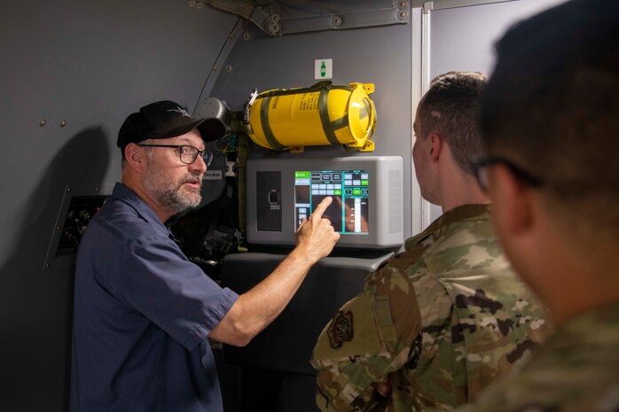 person points at a panel