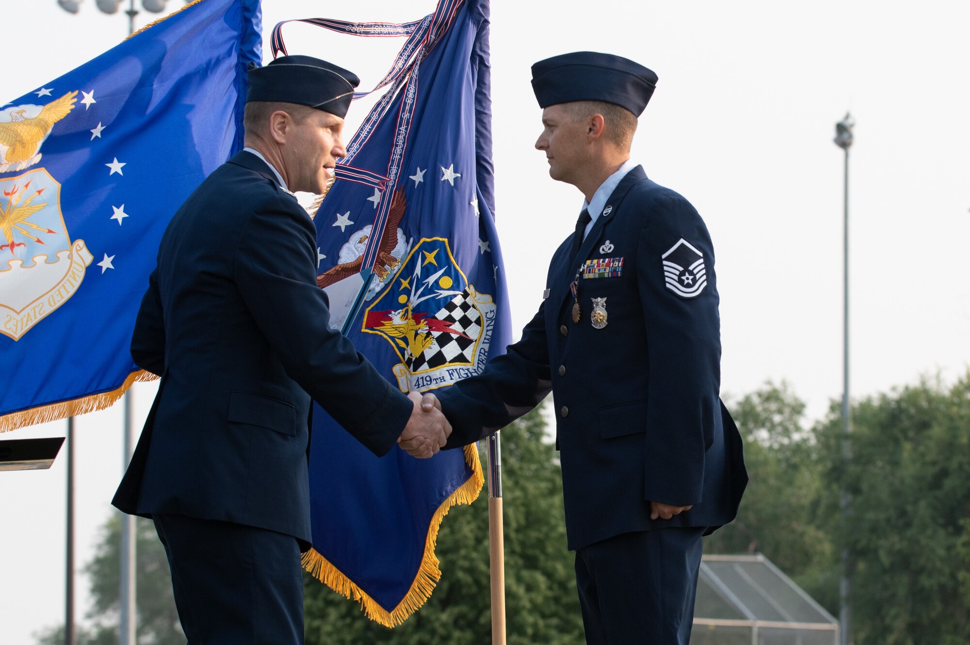 U.S. Air Force Master Sgt. Justin Rogers, 419th Civil Engineer Squadron, receives the Airman’s Medal from Col. Matthew Fritz, 419th Fighter Wing commander, during a ceremony at Hill Air Force Base, Utah on July 11, 2021. Rogers displayed exemplary heroism actions when he saved the life of a trapped driver by pulling him from a burning vehicle.