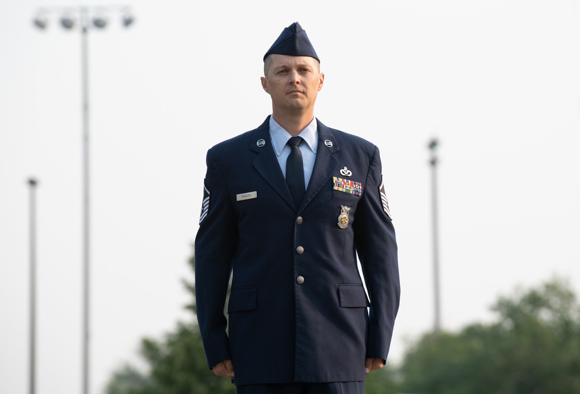 U.S. Air Force Master Sgt. Justin Rogers, 419th Civil Engineer Squadron, stands at attention before being presented the Airman’s Medal at Hill Air Force Base, Utah on July 11, 2021. The Airman’s Medal is a distinguished decoration awarded to those who display heroism or acts of heroism that involve a voluntary risk of life under non-combat conditions.
