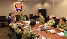 U.S. Army Space and Missile Defense Command leadership briefs U.S. Marine Corps Maj. Gen. David Furness, assistant deputy commandant for plans, policy and operations, on SMDC’s operations at 1st Space Brigade headquarters at Fort Carson, Colorado, July 1. The 1st Space Brigade will soon begin a new initiative to train Marine teams in space-related fields to support joint force warfighters. (U.S. Army photo by Sgt. 1st Class Aaron Rognstad/RELEASED)