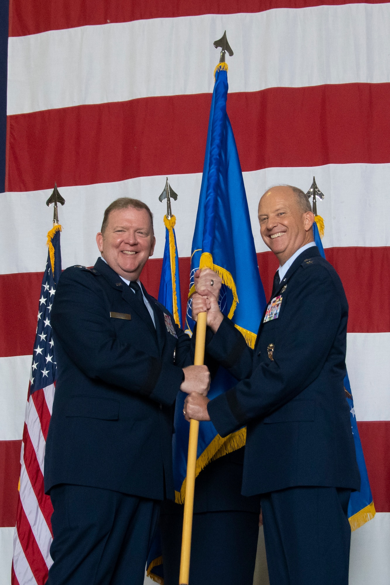 Maj. Gen. Bret C. Larson (right) took command of 22nd Air Force from Maj. Gen. John P. Healy during a ceremony at the Hangar 5, Dobbins Air Reserve Base, Georgia, July 10, 2021.
The ceremony was officiated by Lt. Gen. Richard W. Scobee (left), commander of Air Force Reserve Command and Chief of the Air Force Reserve.

(U.S. Air Force photo by Senior Airman Kendra A. Ransum)