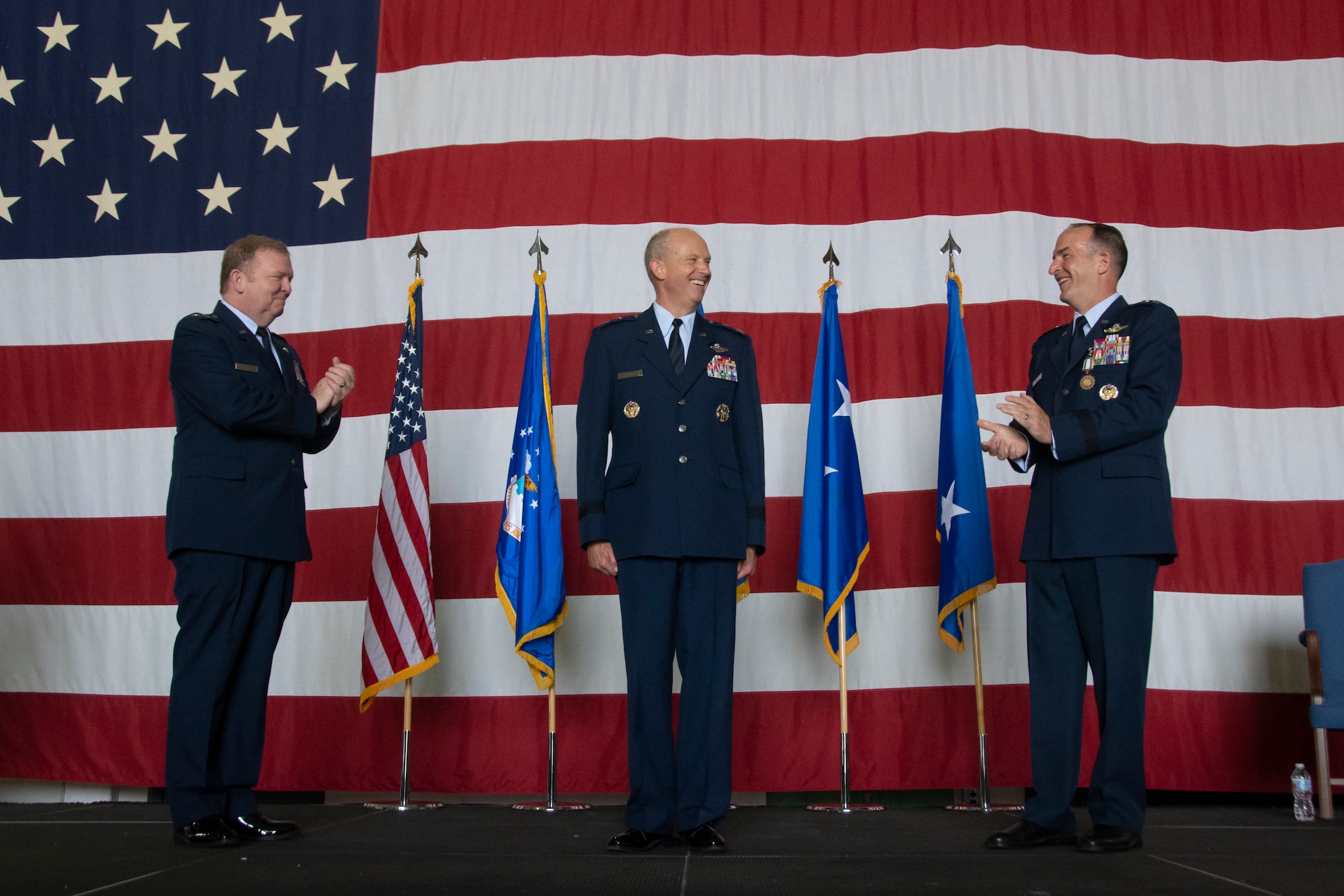 Maj. Gen. Brett C. Larson (center) is applauded by Lt. Gen. Ricahrd W. Scobee (left) and Maj. Gen. John P. Healy (right) following the 22nd Air Force change of command ceremony held at Dobbins Air Reserve Base, Georgia, July 10, 2021.
(U.S. Air Force photo by Senior Airman Kendra A. Ransum)
