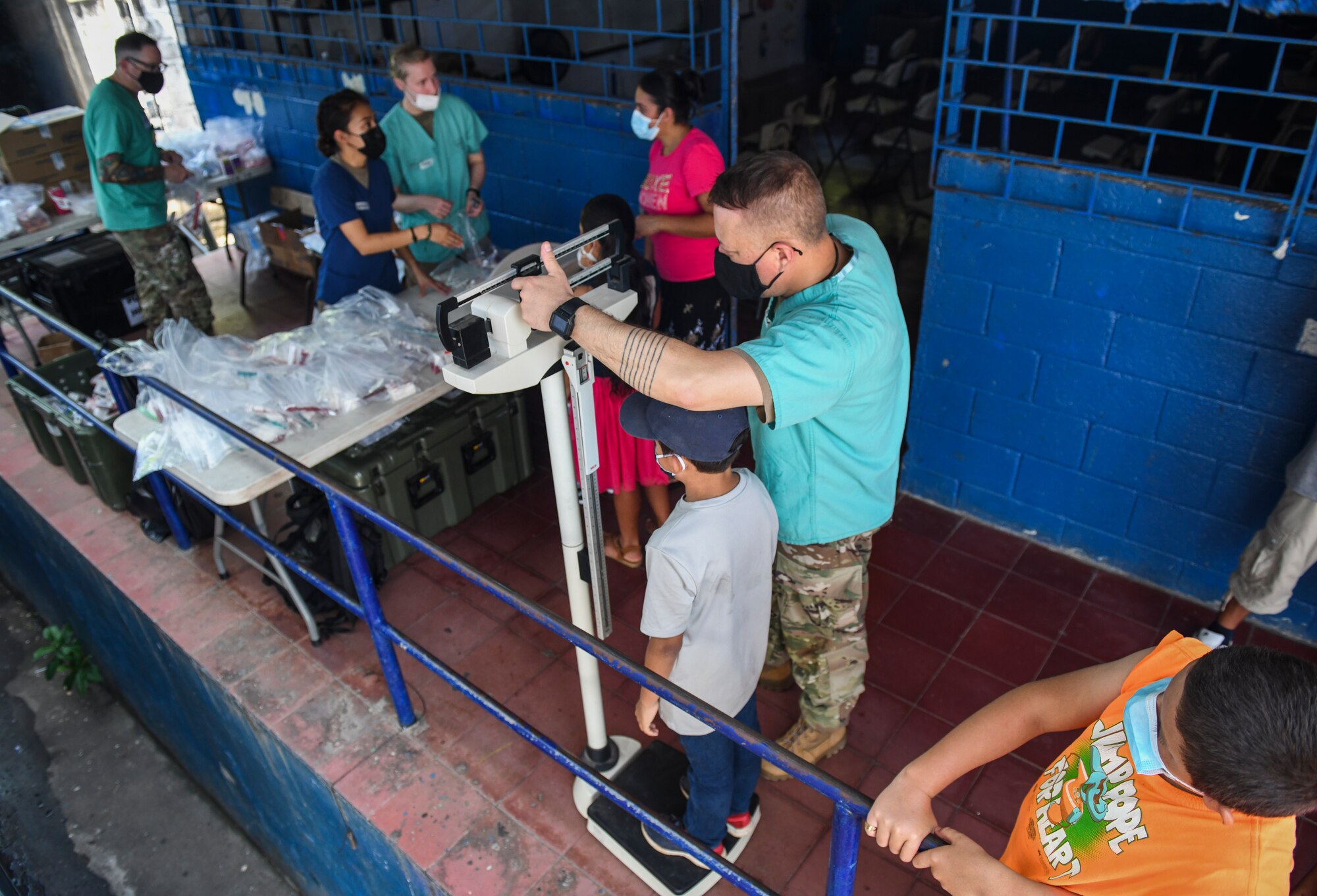 U.S. Army Maj. Morgan Torris-Hedlund, a public health nurse with the Medical Element, Joint Task Force-Bravo, Soto Cano Air Base, Honduras, weighs Salvadoran children during a medical readiness training exercise for Resolute Sentinel 21 at Meanguera Island, El Salvador, May 14, 2021. Children are weighed when they enter the medical site to ensure the correct dosage of medication is prescribed.