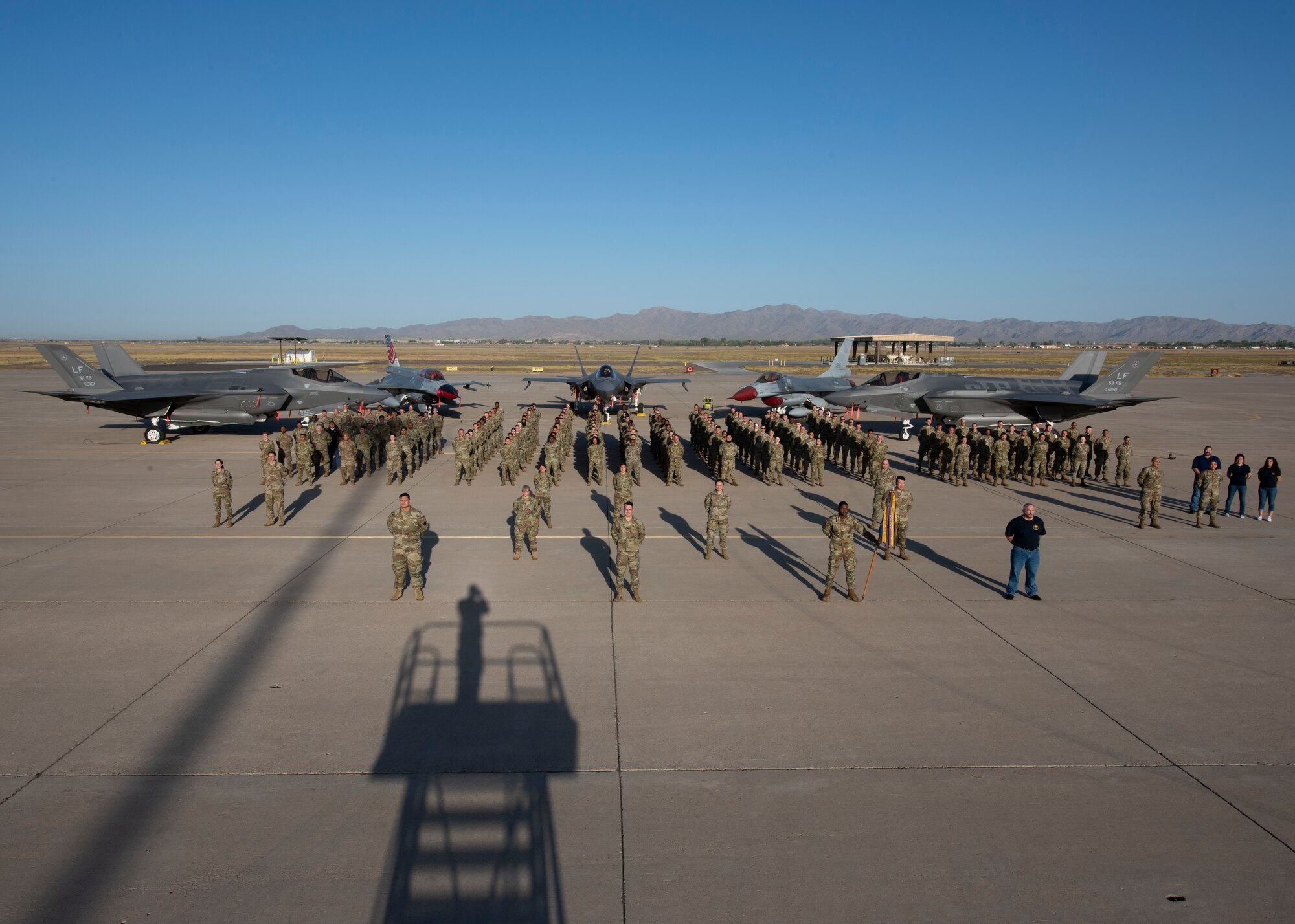 Airmen assigned to the 56th Logistics Readiness Squadron stand in formation, May 10, 2021, at Luke Air Force Base, Arizona. The 56th LRS employs persistent logistics to connect Airmen to their mission and sustain their way of life. (U.S. Air Force photo by Tech. Sgt. Franklin R. Ramos)