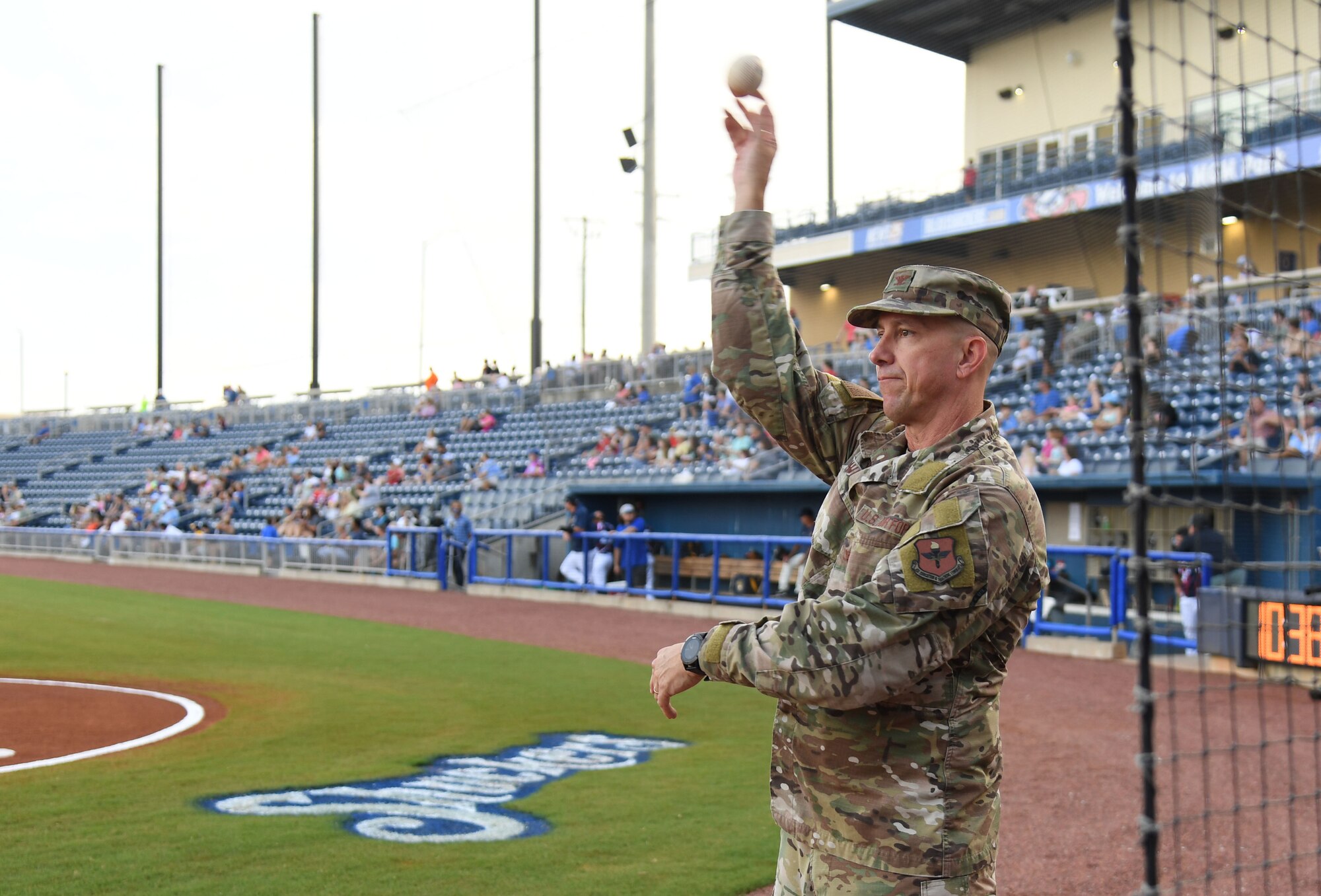 U.S. Air Force Col. William Hunter, 81st Training Wing commander, throws a practice pitch during the Biloxi Shuckers Minor League Baseball game in Biloxi, Mississippi, July 10, 2021. Hunter also recited the oath of office to 10 Air Force delayed entry program recruits during pre-game festivities. (U.S. Air Force photo by Kemberly Groue)