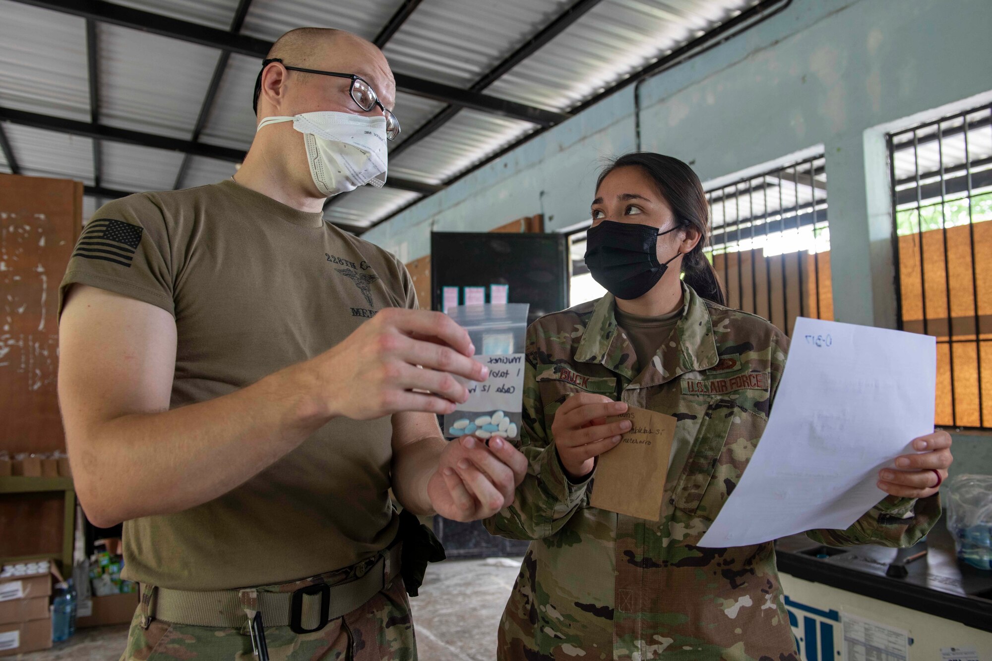 U.S. Air Force Capt. Jennifer Buck, an operations research analyst from the Studies and Analysis Squadron at Joint Base San Antonio-Randolph, Texas, and U.S. Army Spc. Craig Fluth, a healthcare specialist with the 28th Combat Support Hospital of Joint Base San Antonio, Texas, review a patient’s prescribed medications during Resolute Sentinel 21 in Melchor De Mencos, Guatemala, June 17, 2021. Operations research analysts are problem solvers who use advanced analytical techniques, such as big data mining, and optimization and statistical analysis to come up with solutions that help businesses and organizations operate more efficiently and cost-effectively.