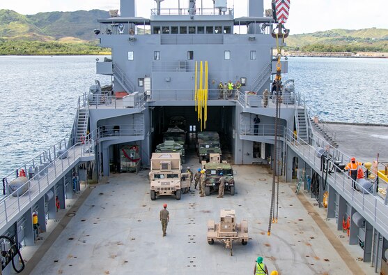 Military vehicles and containers are unloaded from the United States Army Vessel Lt. Gen. William B. Bunker, in support of Forager 21, at Naval Base Guam, July 10, 2021. Through innovation and experimentation during Forager, the theater Army is finding new ways to employ Army watercraft systems to increase logistical options to the commander and present new dilemmas to adversaries. (U.S. Army photo by Spc. Richard Carlisi, I Corps Public Affairs)