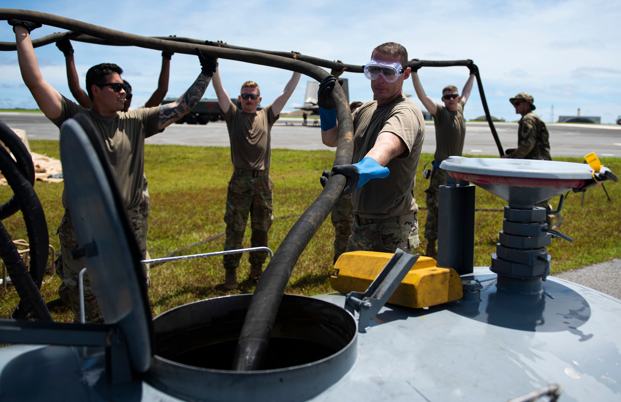 U.S. Air Force Airmen from multiple bases tear down a fuel bladder after a hot refuel during exercise Valiant Shield at Andersen Air Force Base, Guam, Sept. 24, 2020. Valiant Shield is a U.S.-only, biennial field training exercise (FTX) with a focus on integration of joint training among U.S. forces in relation to current operational plans. This training enables real-world proficiency in sustaining joint forces through detecting, locating, tracking and engaging units at sea, in the air, on land, and in cyberspace in response to a range of mission areas. ( U.S. Air Force photo by Senior Airman Michael S. Murphy)