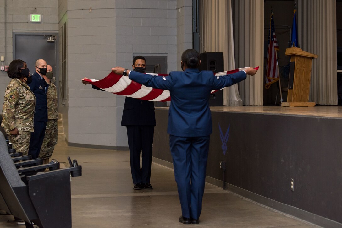 A U.S. flag is folded in honor of Senior Airman Lauren Delany during her memorial ceremony at Edwards Air Force Base, California, Feb. 18. (US Airforce Photo By Richard Gonzales)