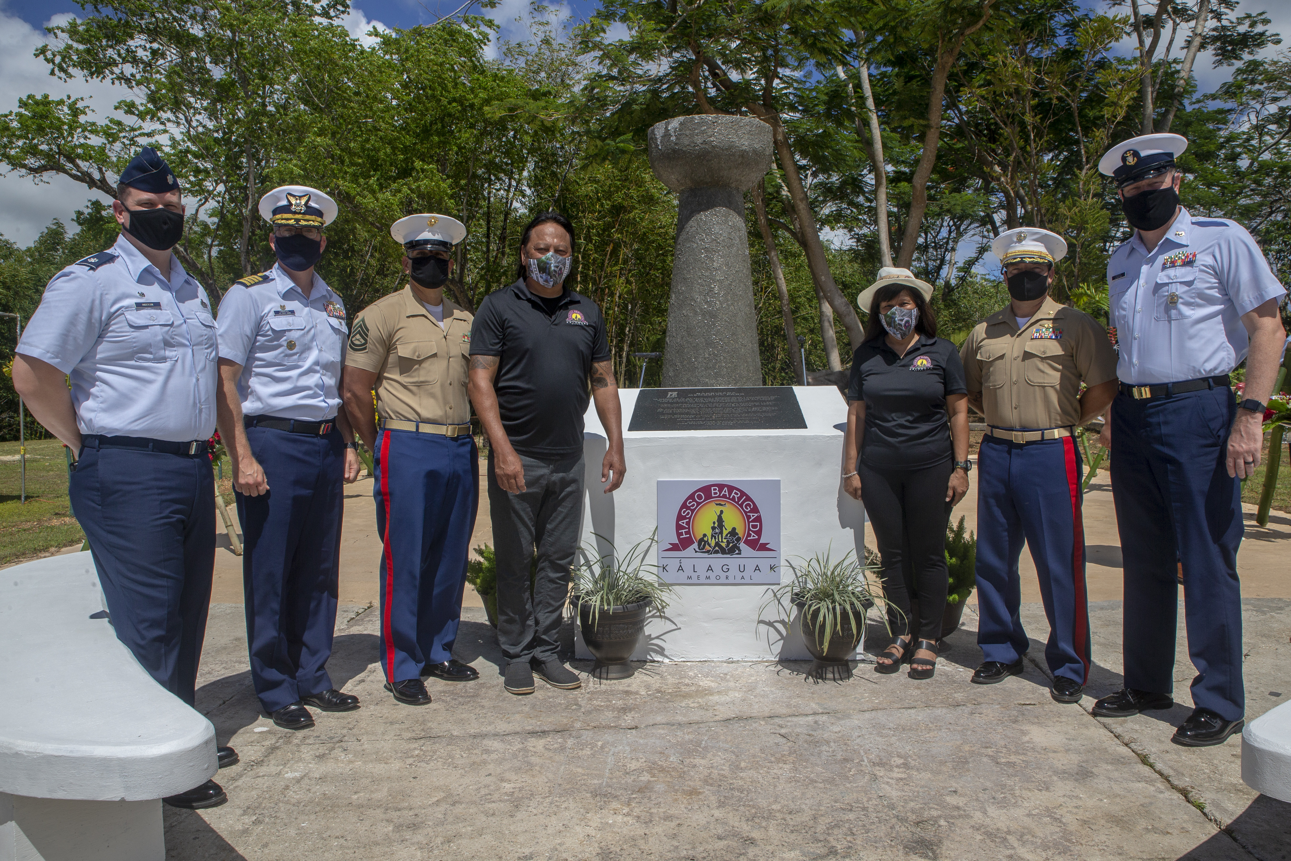 Marine Corps Base (MCB) Camp Blaz senior leaders pose for a photograph with other senior military leaders and the mayor and vice mayor of Barrigada, Guam in front of the Kǻlaguak memorial, July 9, 2021.