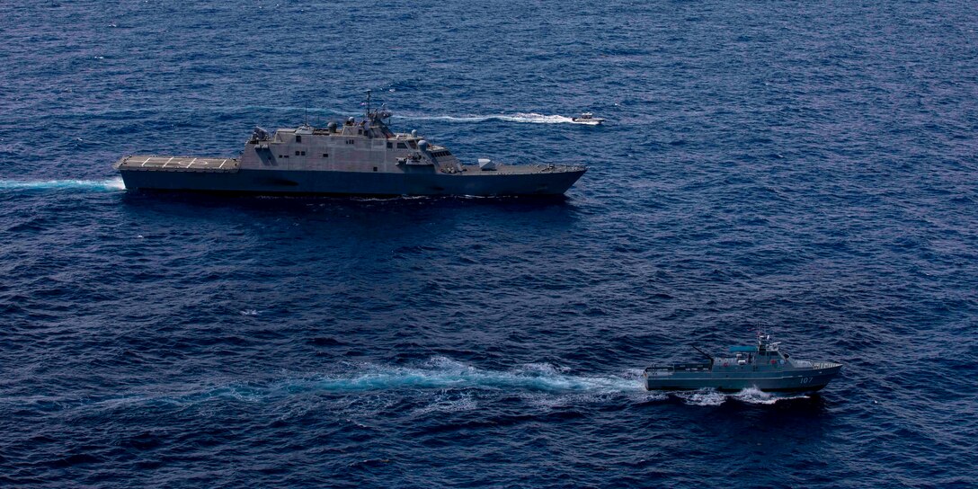 USS Billings (LCS 15) conducts a passing exercise (PASSEX) with Dominican Republic navy Swiftship-110’-class patrol boat Canopus (GC 107) and Justice Boston whaler-class boat Nunke (LI 163), July 10.