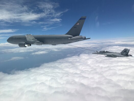 NH based KC-46A aircrew refuel a U.S. Navy F/A-18F Super Hornet off the coast of Maryland, July 1, 2020. This marked the first time the aircrew utilized the KC-46A centerline drogue system to refuel an aircraft. (Photo by Lt. Zach Fisher, U.S. Navy)