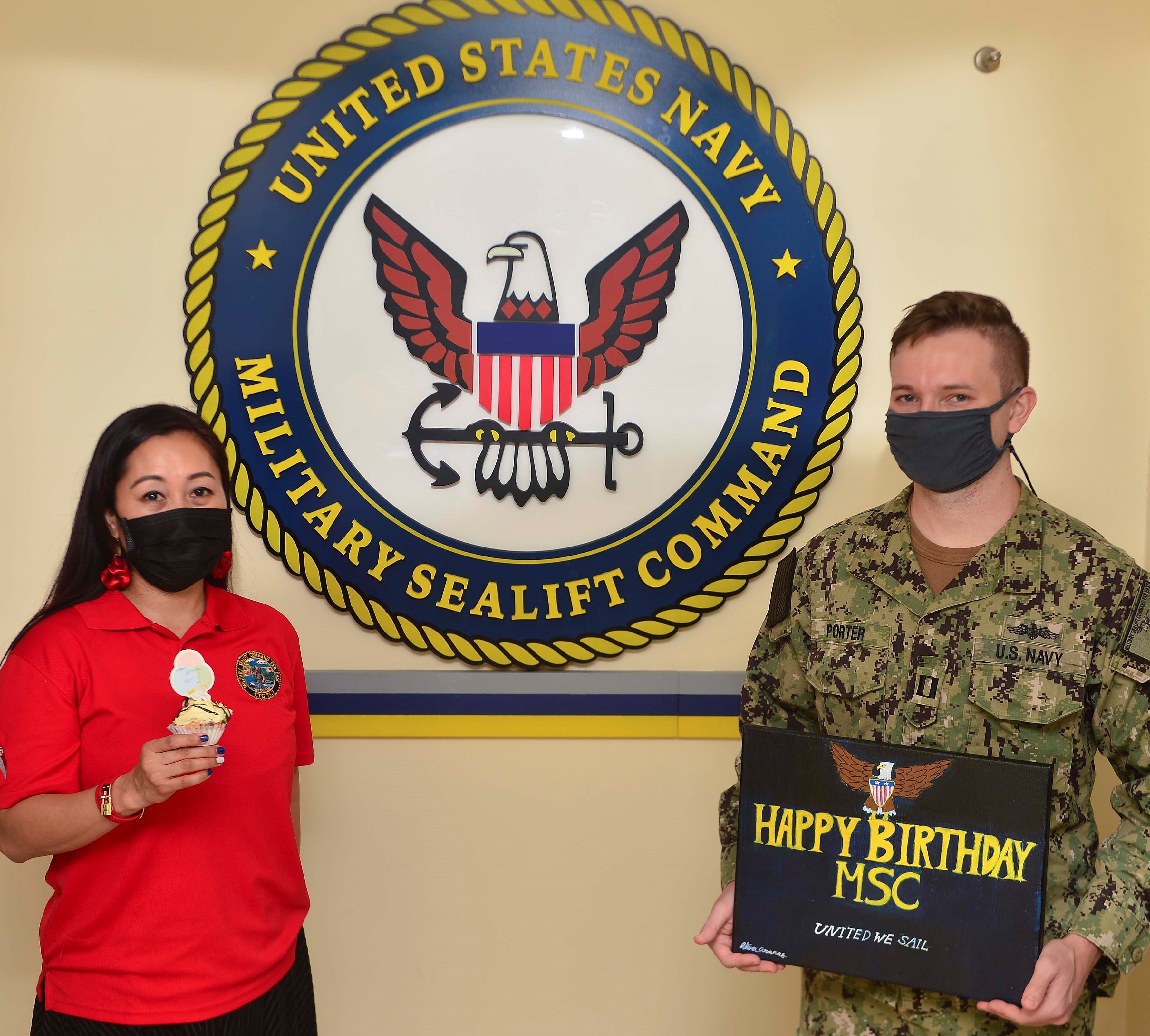 210709-N-UA460-002 SINGAPORE (July 9, 2021) From left, Military Sealift Command Far East’s Theresa Aranas and Lt. Gerrit Porter, a reservist, recognize MSC’s birthday on July 9.   MSC FE ensures approximately 50 ships in the Indo-Pacific region, are manned, trained and equipped to deliver essential supplies, fuel, cargo, and equipment to warfighters, both at sea and on shore. Task force commanders employ these ships to ensure mission accomplishment. COMLOG WESTPAC/CTF 73 is the U.S. 7th Fleet's provider of combat-ready logistics, operating government-owned and contracted ships that keep units throughout 7th Fleet armed, fueled and fed. As the U.S. Navy's largest forward-deployed fleet, 7th Fleet employs 50-70 ships and submarines across the Western Pacific and Indian oceans. U.S. 7th Fleet routinely operates and interacts with 35 maritime nations while conducting missions to preserve and protect a free and open Indo-Pacific Region. Military Sealift Command is the leading provider of ocean transportation for the Navy and the rest of the Department of Defense - operating approximately 125 ships daily around the globe. (U.S. Navy photo by Mass Communication Specialist 1st Class Gregory Johnson)