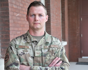 Staff Sgt. Scott Singleton poses outside the 157th Air Operations Group during April 2021 drill.