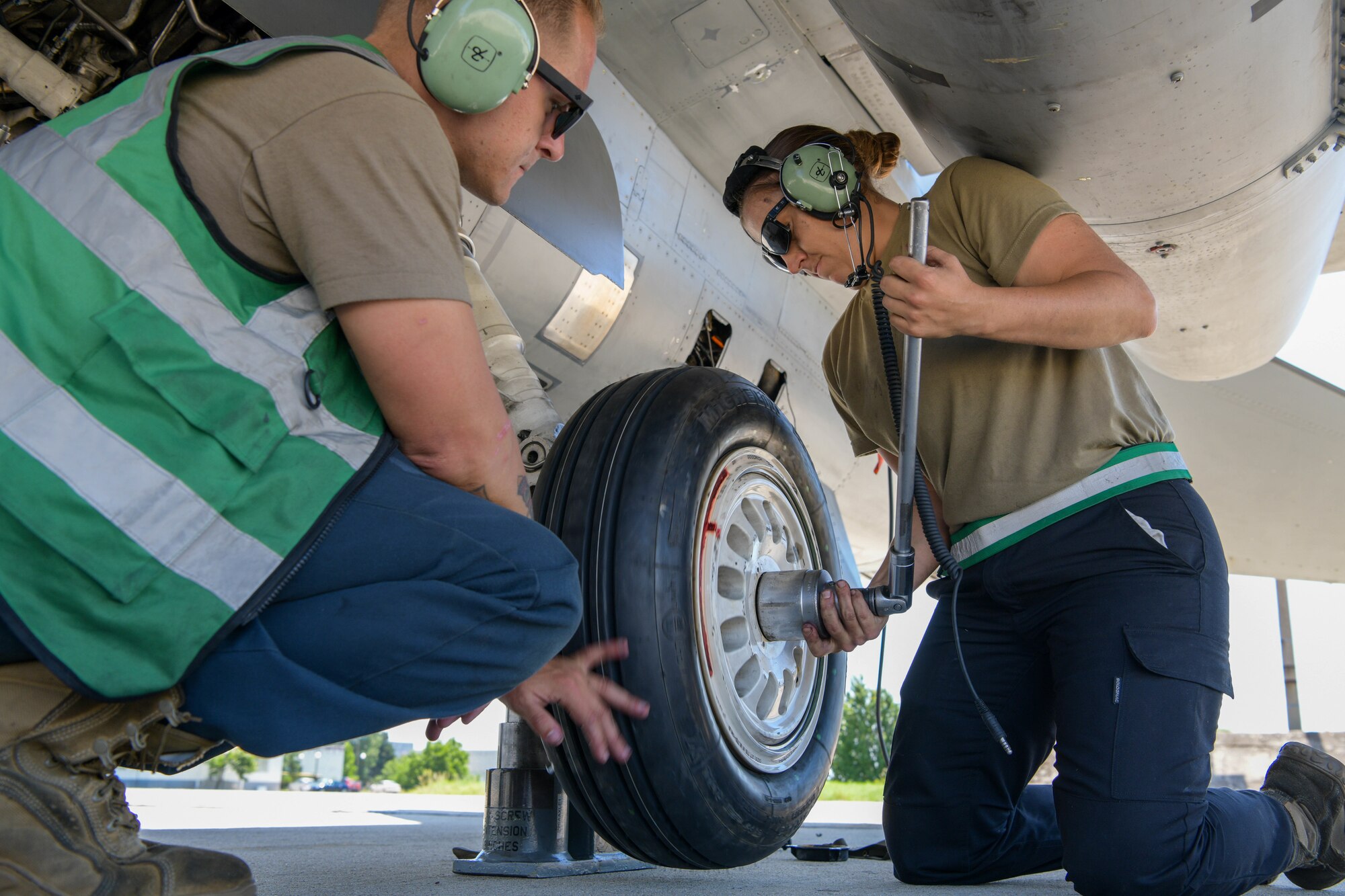 U.S. Air Force F-16 Fighting Falcon crew chiefs assigned to the 555th Aircraft Maintenance Unit replace an F-16 tire during exercise Thracian Star 21 at Graf Ignatievo Air Base, Bulgaria, July 9, 2021. More than 150 personnel and eight F-16s assigned to the 555th Fighter Squadron are participating in Thracian Star 21, a Bulgarian air force-led, multilateral training exercise, aimed to enhance the ability to rapidly deploy to remote locations and provide credible force to assure stability for the region. (U.S. Air Force photo by Airman 1st Class Brooke Moeder)