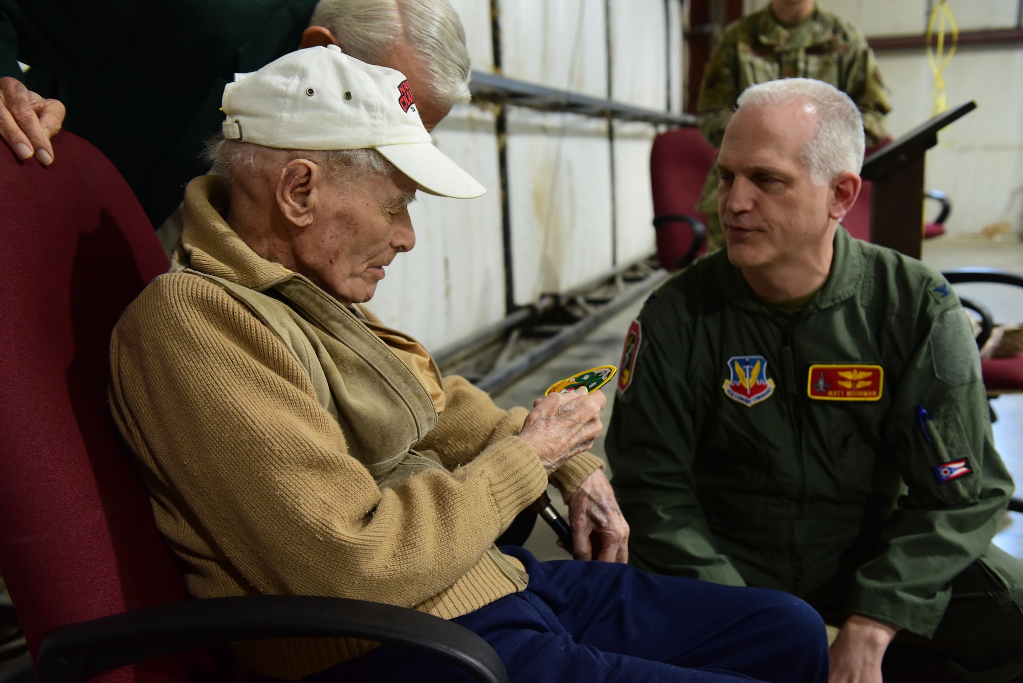U.S. Air Force Lt. Col. (retired) Darrell Larkin is given a 178th Wing patch from Medical Group Commander Col. Matt Moorman May 8, 2021 at the Highland County Airport, Hillsboro, Ohio. Larkin retired from the Ohio Air National Guard as a Lt. Col. before rejoining years later to retire a second time as an Ohio Air National Guard Tech. Sgt. (Air National Guard photo by Airman Jillian Maynus)