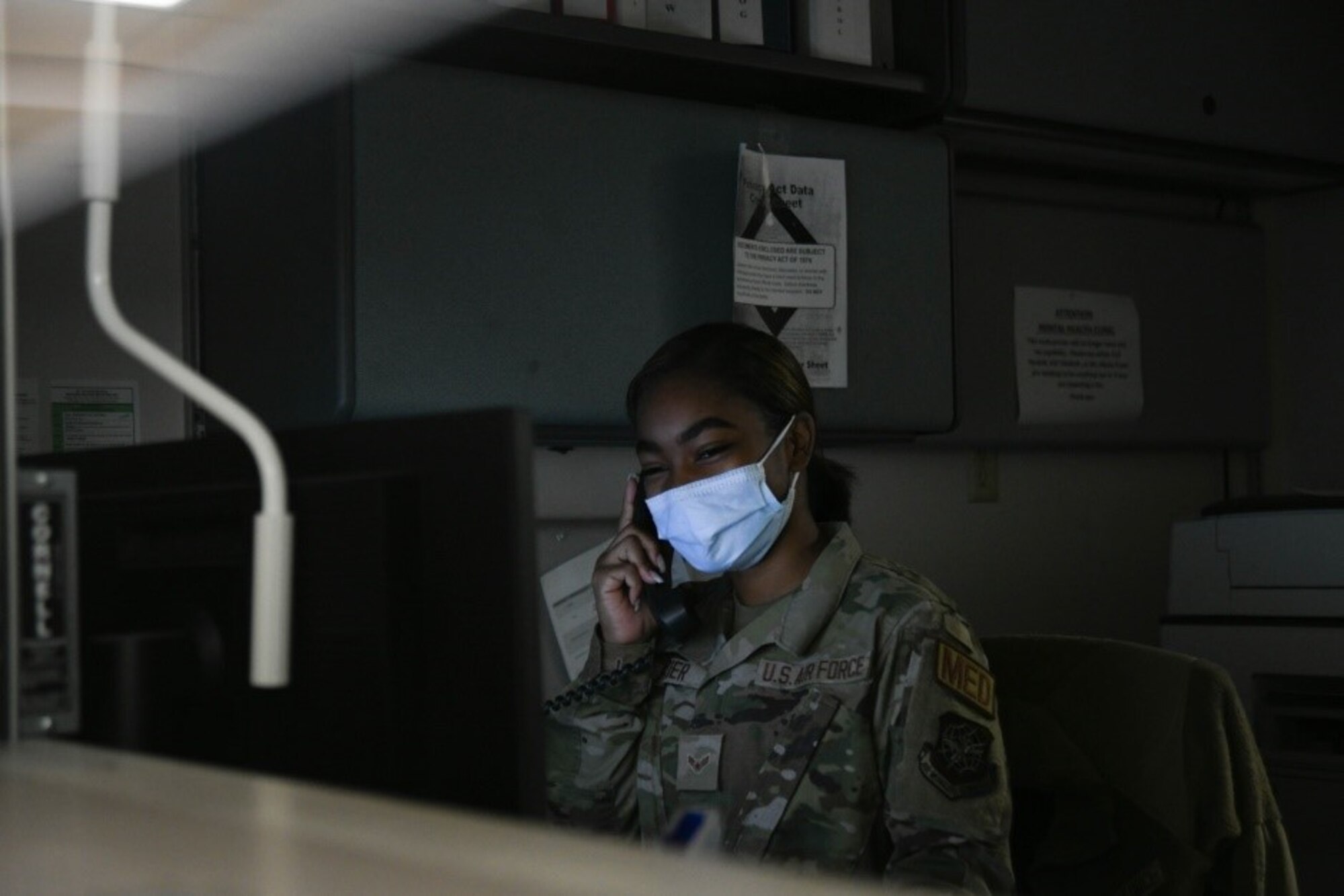 Airman 1st Class Chasity Frazier, 22nd Medical Operations Squadron mental health technician, greets an Airman over the phone June 11, 2021, at McConnell Air Force Base, Kansas. Technicians work alongside psychiatrists and psychologists, and are responsible for ensuring every Airman is mentally fit by helping evaluate and provide mental healthcare. (U.S. Air Force photo by Senior Airman Nilsa Garcia)