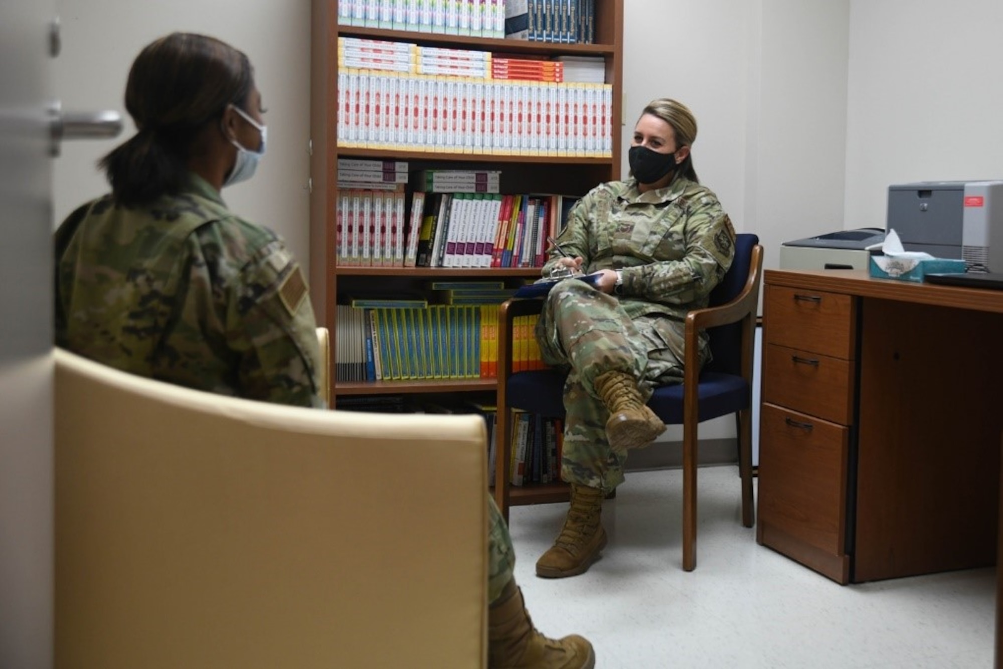 Staff Sgt. Alicia Delvaux, 22nd Medical Operations Squadron mental health technician, speaks to an Airman in her office during an appointment June 11, 2021, at McConnell Air Force Base, Kansas. Patients have the option of self-referral either via phone line or by stopping by the clinic during duty hours. (U.S. Air Force photo by Senior Airman Nilsa Garcia)