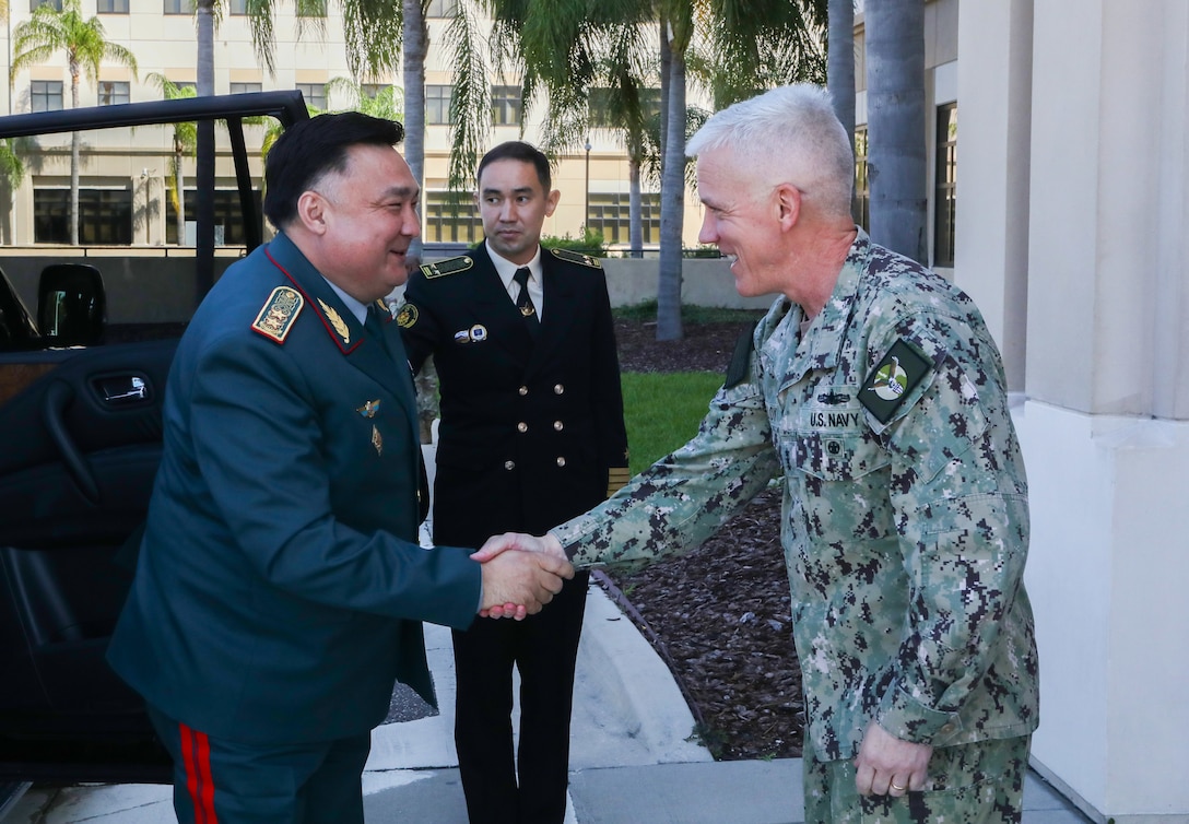 U.S. Navy Vice Adm. James Malloy, Deputy Commander, U.S. Central Command (USCENTCOM), right, welcomes Gen. Lt.  Timur Dandybayev, Kazakhstan’s Deputy Minister of Defense, left, to USCENTCOM headquarters at MacDill Air Force Base, Fla. July 12, 2021. The two leaders discussed the strategic security cooperation between the U. S. and Kazakhstan and addressed the evolving security situation in the Central Asia region. Both leaders agreed on the importance of deepening bilateral ties and shared their desire to continue close collaboration on issues such as counterterrorism, border security, and international exchanges. (U.S. Central Command Public Affairs photo by Tom Gagnier)